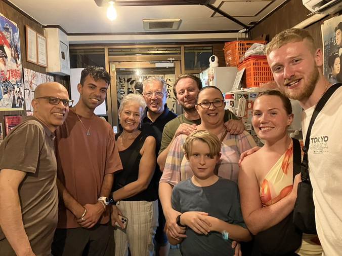 A group of people posing for a photo

AI-generated content may be incorrect.