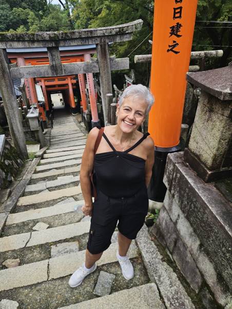 A person standing on a stone staircase

AI-generated content may be incorrect.