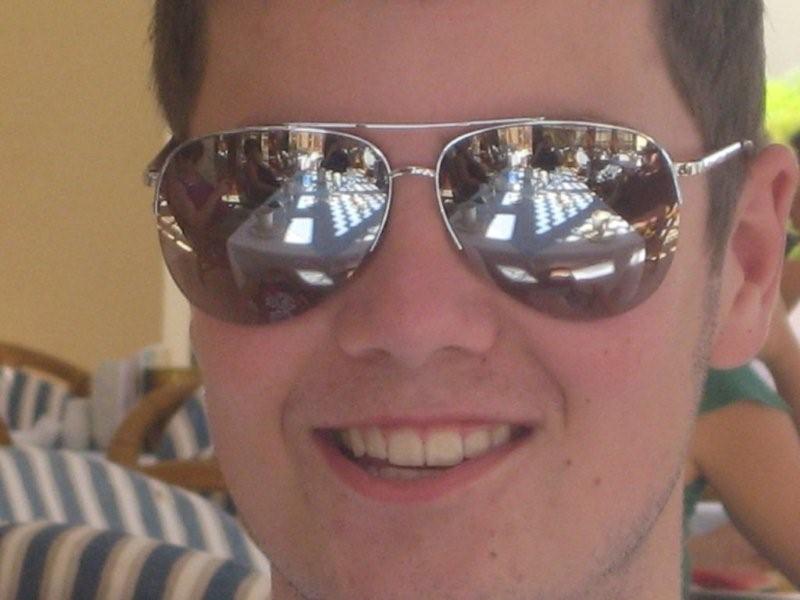 Anthony in mirrored sunglasses