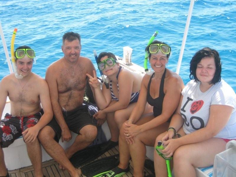The whole family snorkelling on the boat