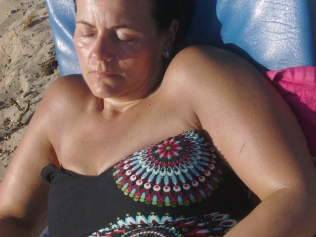 Carol sunbathing on the beach