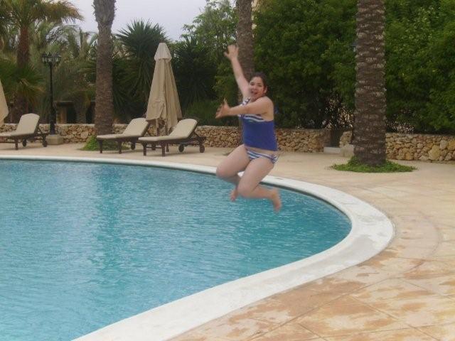 Sian jumping into the pool