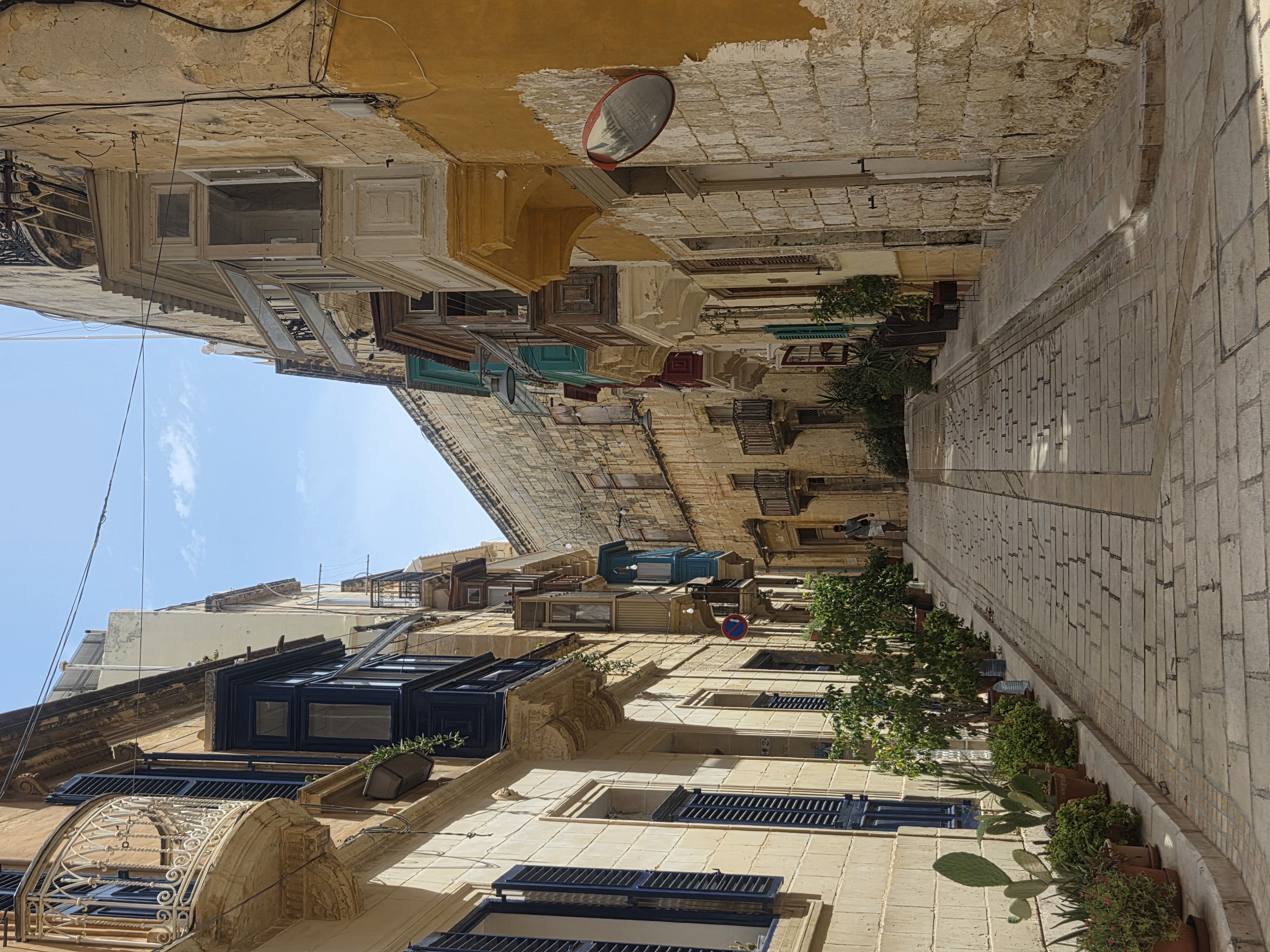 Cobblestoned street with blue shutters