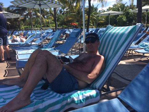 Jeff by the pool, working on the blog