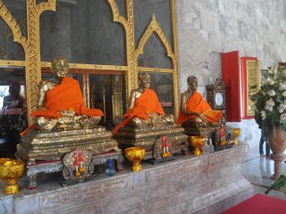 Coin buckets at Wat Chalong
