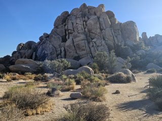 A large rock formation in the desert

Description automatically generated