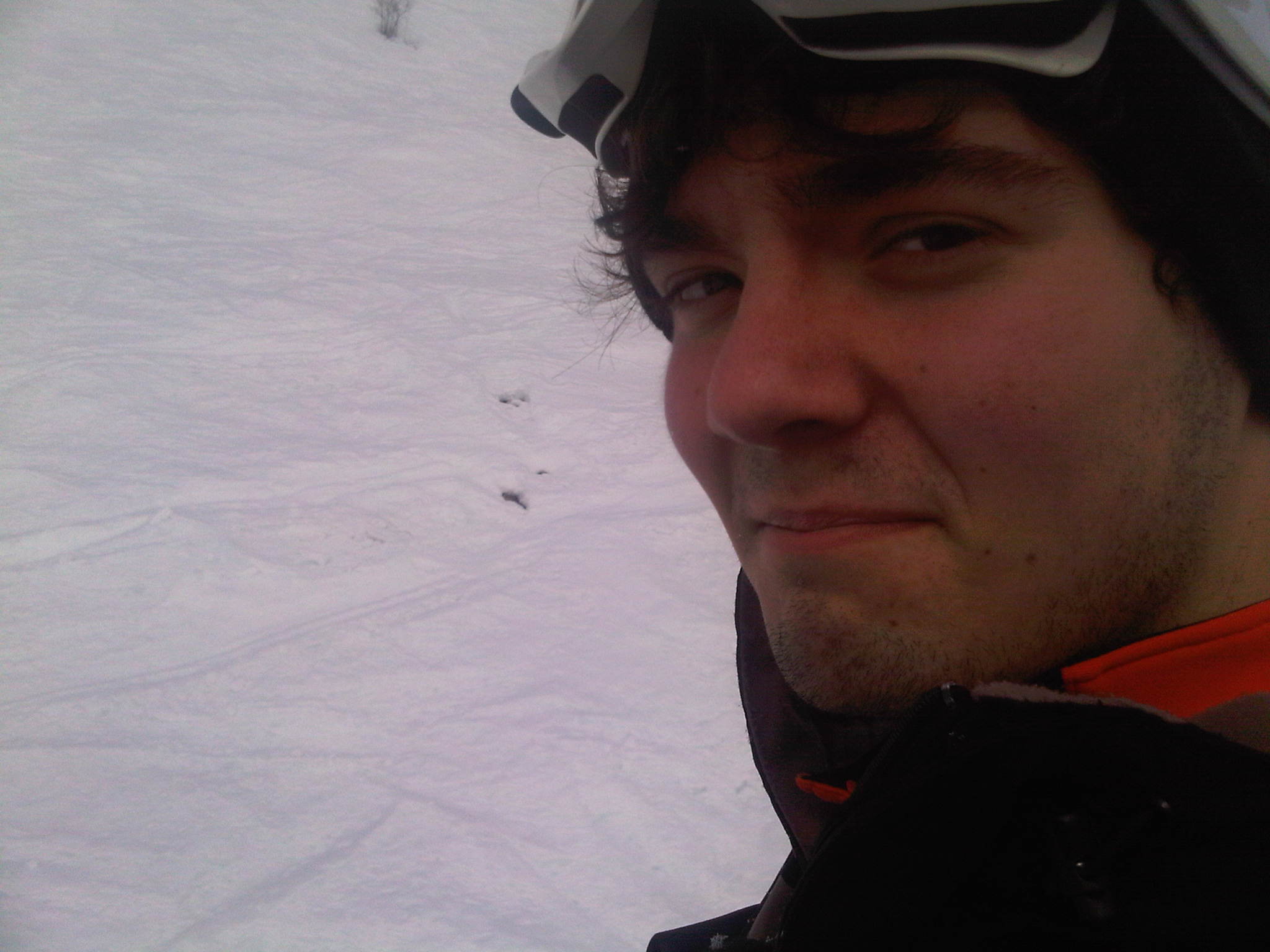 Selfie on the slopes wearing ski goggles
