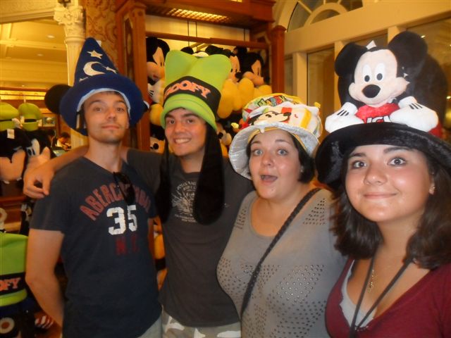 The group trying on novelty Disney character hats in the gift shop