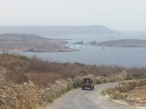 The road to Hondoq from Qala, with Comino in the distance