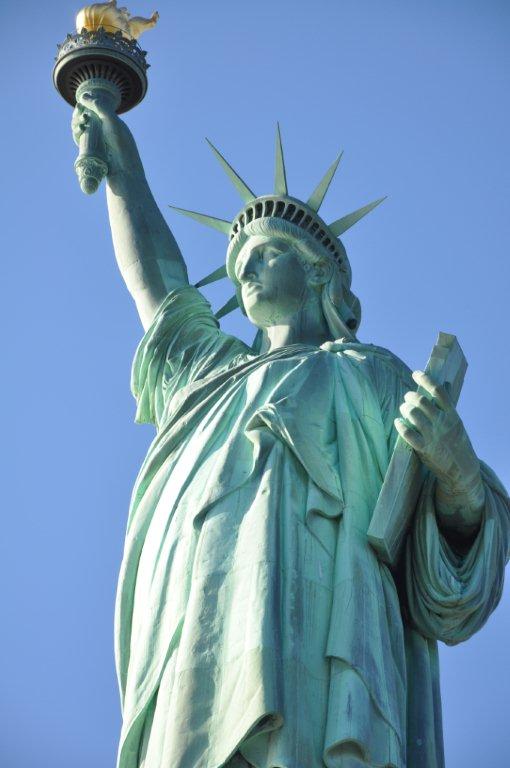 The Statue of Liberty against a clear blue sky