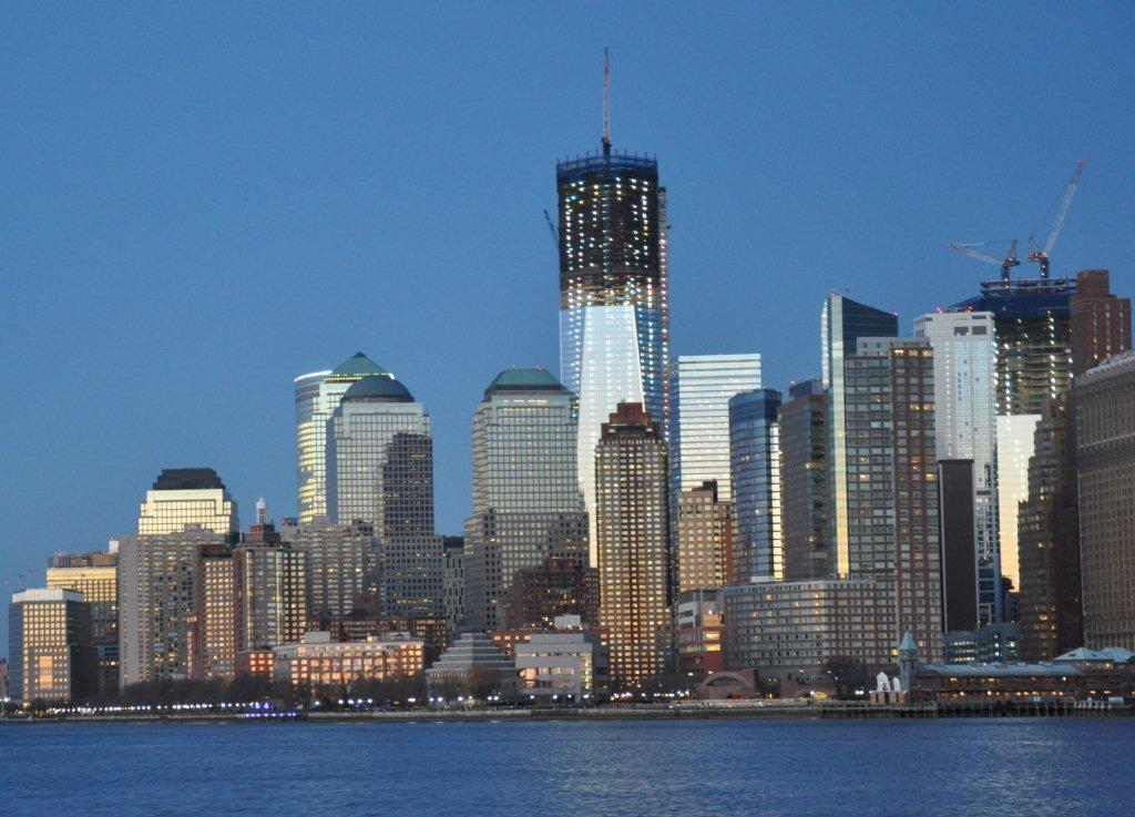 View of the Freedom Tower and lower Manhattan skyline at dusk