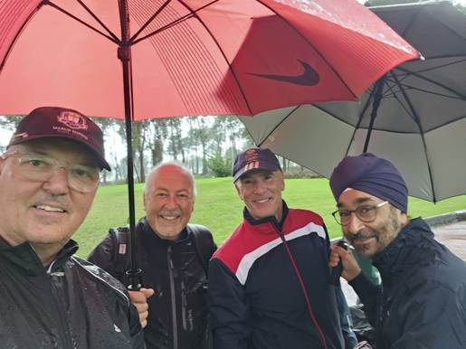 A group of men under umbrellas

AI-generated content may be incorrect.
